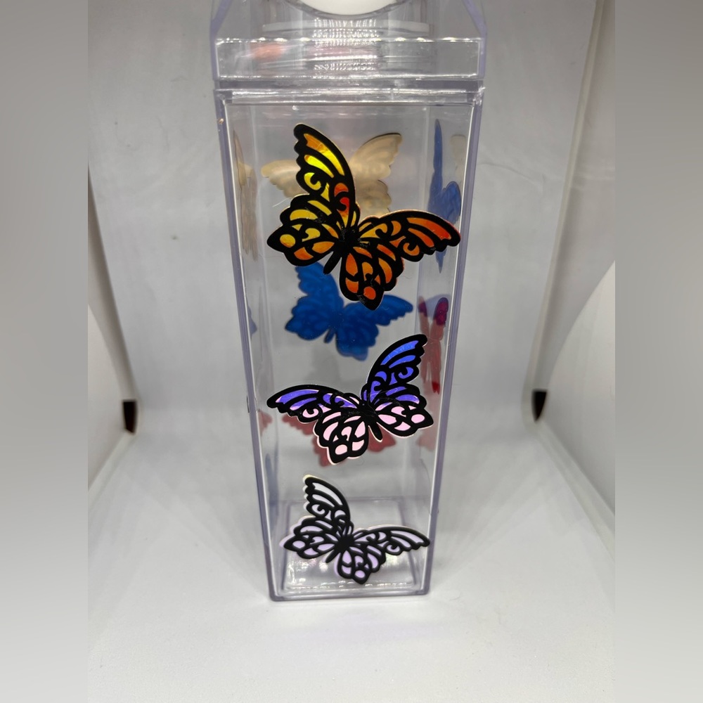 NWOT Milk Carton Water Bottle with holographic vinyl butterflies.
